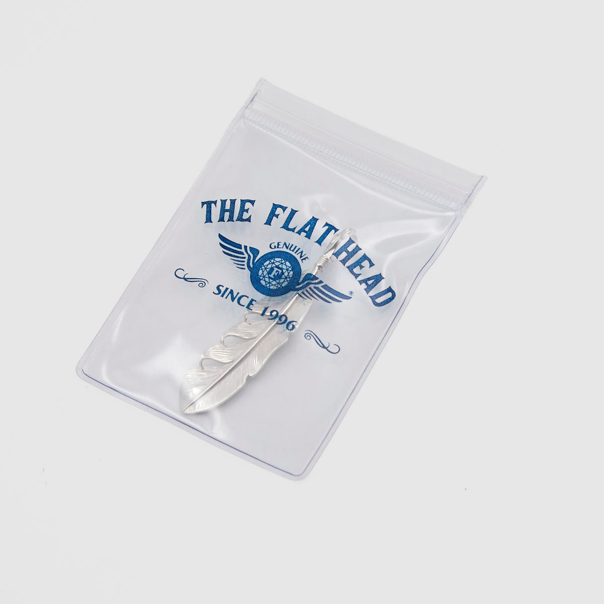 The Flat Head Mid Sized Feather Sterling Pendant