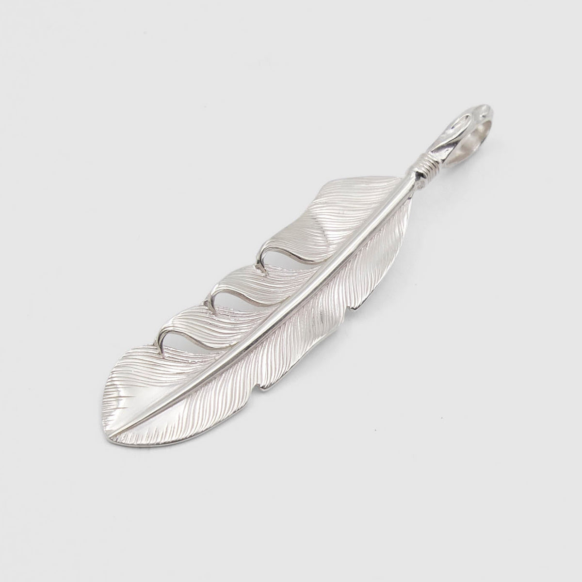 The Flat Head Mid Sized Feather Sterling Pendant