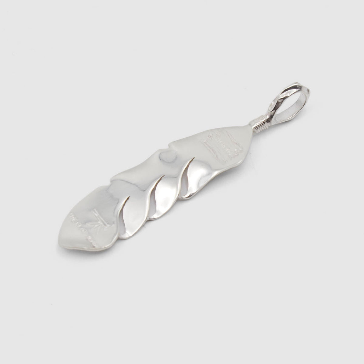 The Flat Head Mid Sized Feather Sterling Pendant