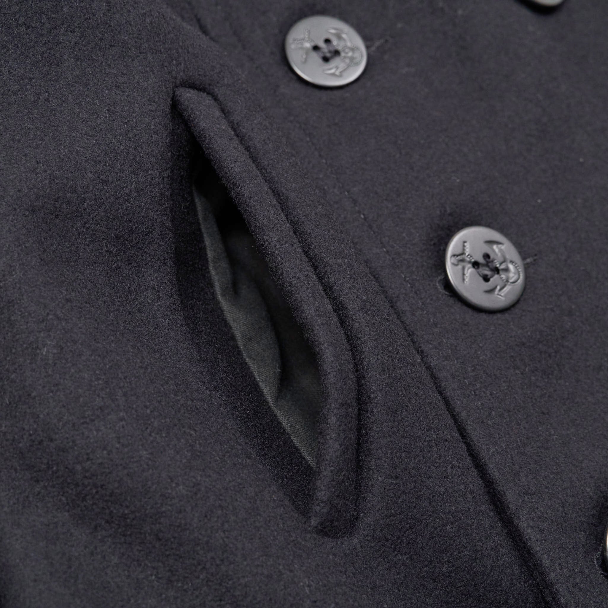 Pea coat with top anchors on buttons