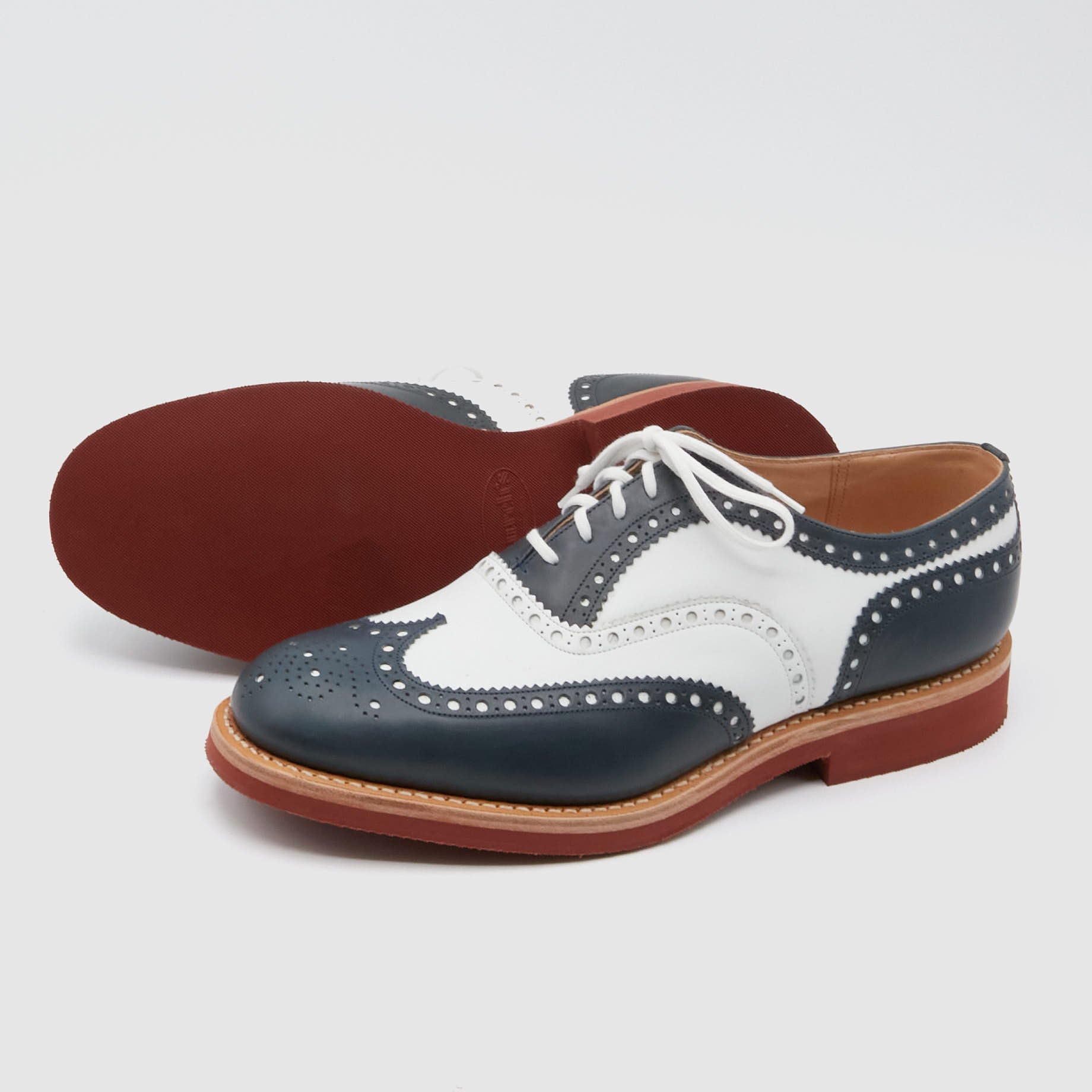 Red and white wingtip shoes top